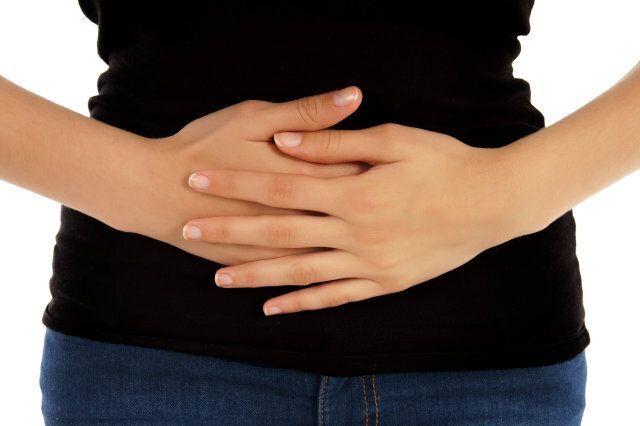 Pain in the abdomen on white background