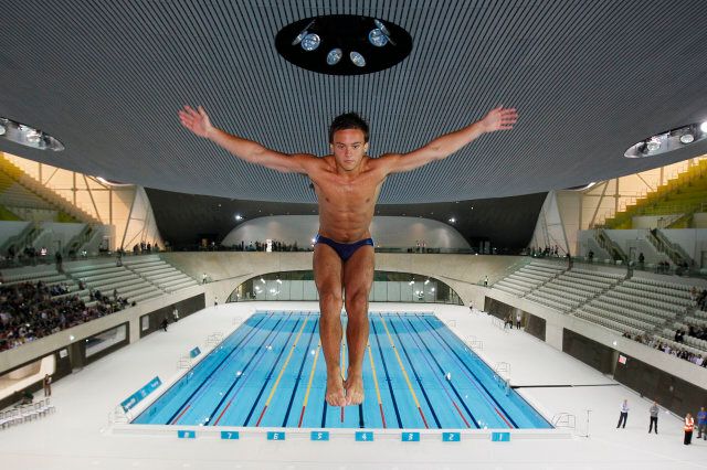 British Olympic diver Tom Daley performs a dive into the new aquatic centre dive pool at the one year to go ceremony in London, Wednesday, July 27, 2011. (AP Photo/Kirsty Wigglesworth, pool)