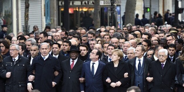 From left : European Commission President Jean-Claude Juncker, Israeli Prime Minister Benjamin Netanyahu, Malian President Ibrahim Boubacar Keita, French President Francois Hollande, German Chancellor Angela Merkel, European Union President Donald Tusk, Palestinian president Mahmud Abbas, and other heads of state take part in a Unity rally 'Marche Republicaine' on January 11, 2015 in Paris in tribute to the 17 victims of the three-day killing spree. The killings began on January 7 with an assaul