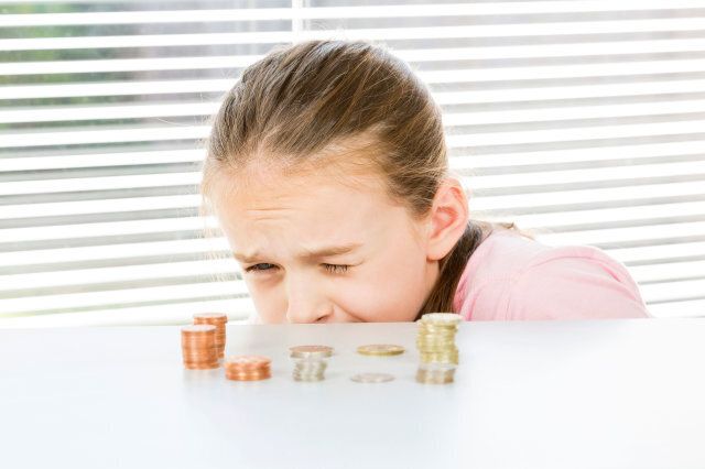 young girl counting coins