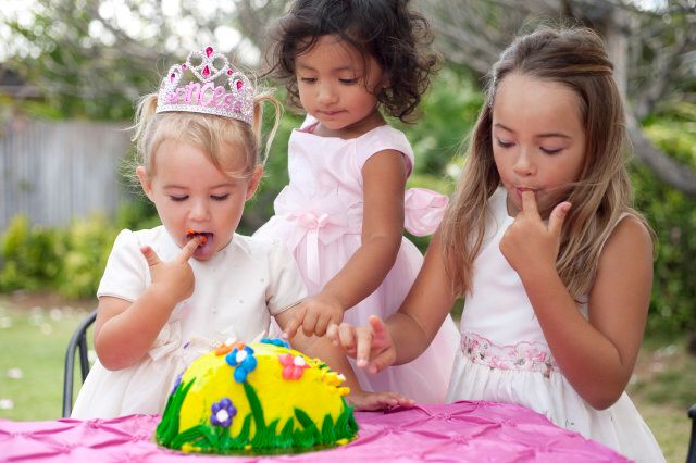 three cute little girls with cake