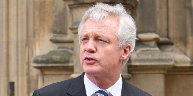 David Davis is pictured outside the House Of Commons in London this afternoon where he announced his resignation as shadow Home Secretary and Conservative MP.