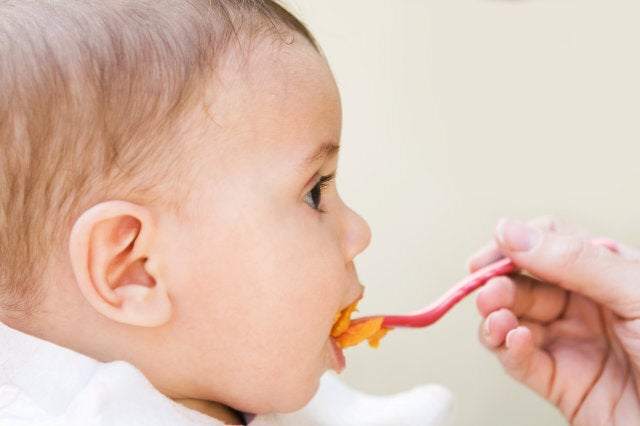 Baby boy being fed