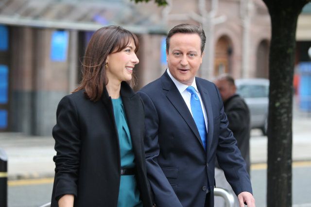 Prime Minister David Cameron arrives with wife Samantha on the final day of the Conservative Party Conference at Manchester Central in Manchester.