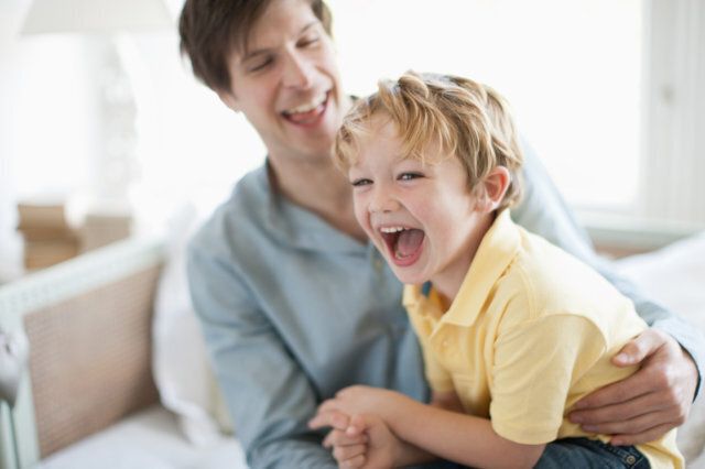 Father and son laughing