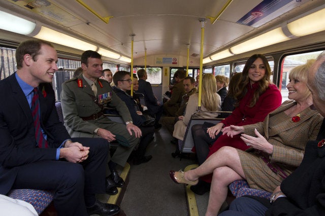 The Duke (left) and Duchess of Cambridge (2nd right) and Barbara Windsor (right) surprised hundreds of commuters as they travelled on a 1960s Routemaster bus to High Street Kensington station where they met military personnel and volunteers supporting London Poppy Day.