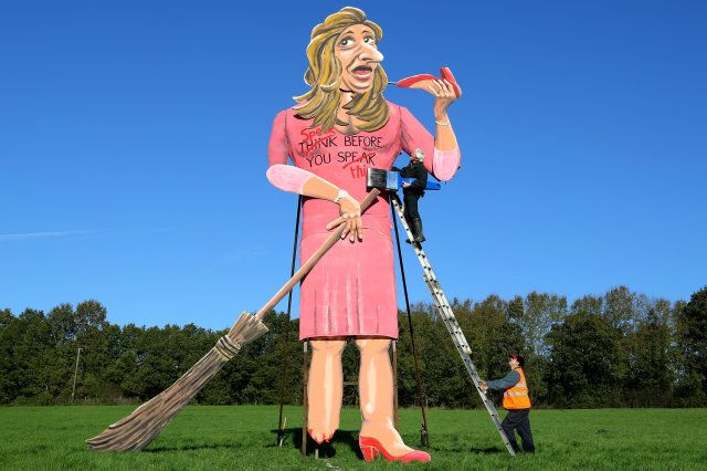 Artist Frank Shepherd puts the final touches to his creation of Katie Hopkins who has been unveiled as this year's Edenbridge Bonfire Society celebrity guy during a photcall in Edenbridge, Kent. Picture date: Wednesday October 30, 2013. See PA Story SOCIAL Bonfire Photo credit should read: Gareth Fuller/PA Wire