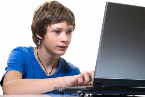 Boy deep in a computer game