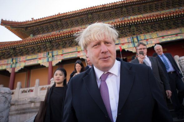 London Mayor Boris Johnson meets tourists as he tours the Forbidden City in Beijing today. The Mayor is on a week long visit to China encouraging closer business links the with the capital.