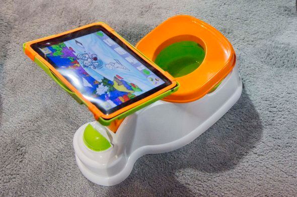 The iPotty for iPad potty training device is see on display at the Consumer Electronics Show, Wednesday, Jan. 9, 2013, in Las Vegas. No app is available to go with the trainer, but the idea is to keep the child on the toilet for as long as necessary by keeping them digitally entertained. (AP Photo/Julie Jacobson)