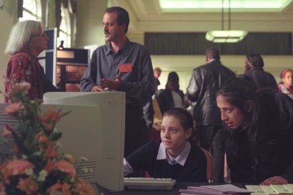 Two children using a computer at a school open day, Hackney Town Hall, London, UK.