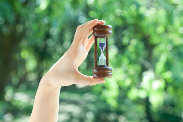 Woman holding a hourglass