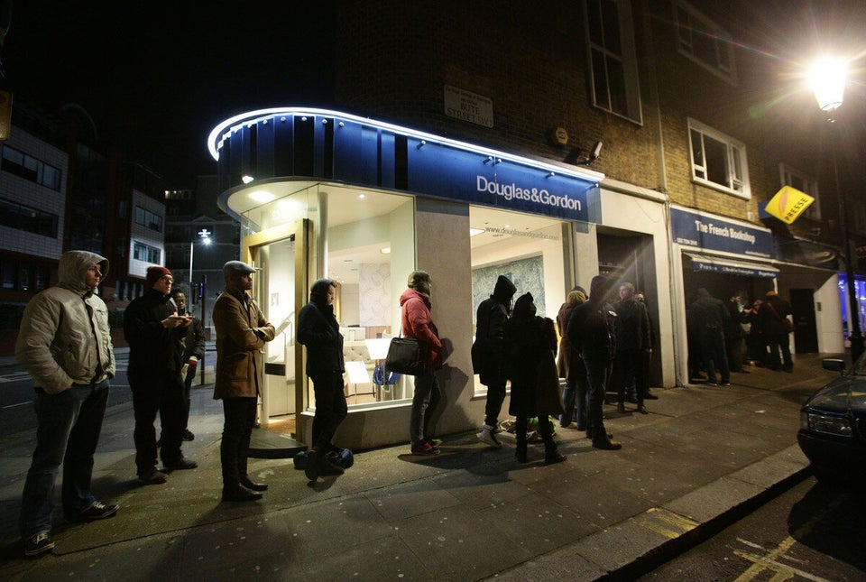 Brits queue outside The French Bookshop in Kensington