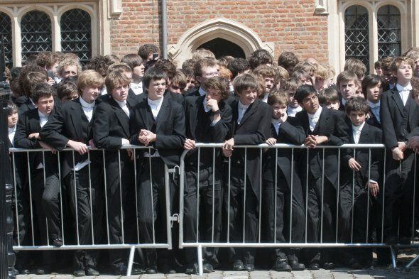 Pupils wait see Queen Elizabeth II as she visits Eton College in Berkshire to mark the 150th anniversary of the school.