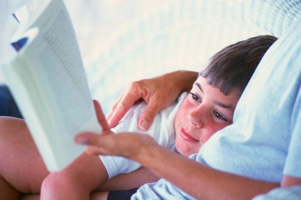 Father reading story to son