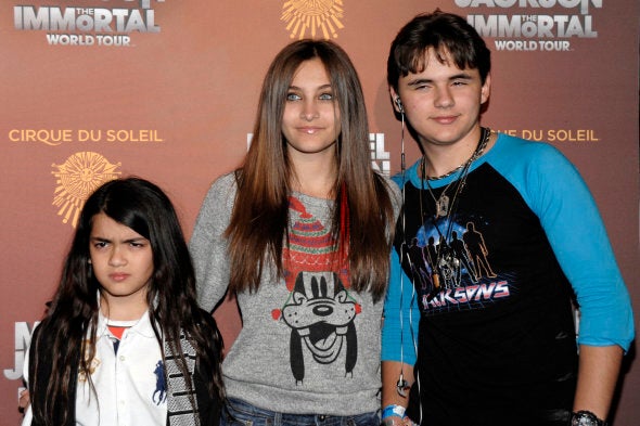 FILE - This Jan. 27, 2012 file photo shows, from left, Blanket Jackson, Paris Jackson, and Prince Michael Jackson at the opening night of the Michael Jackson The Immortal World Tour in Los Angeles. A judge overseeing a guardianship of Michael Jackson's children said Tuesday June 25, 2013, that he was making no changes to oversight of the children after receiving an investigator's report on their well-being and speaking with lawyers for their guardians, Katherine and TJ Jackson. (AP Photo/Dan Steinberg, file)