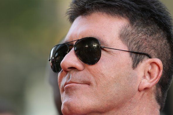 Simon Cowell arriving for the World Premiere of One Direction: This Is Us, at the Empire Leicester Square, London.