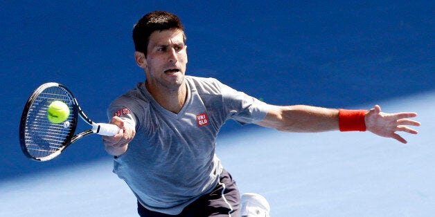 Novak Djokovic of Serbia returns a forehand shot during a training session at the Australian Open tennis championship in Melbourne, Australia, Sunday, Jan. 18, 2015. (AP Photo/Lee Jin-man)