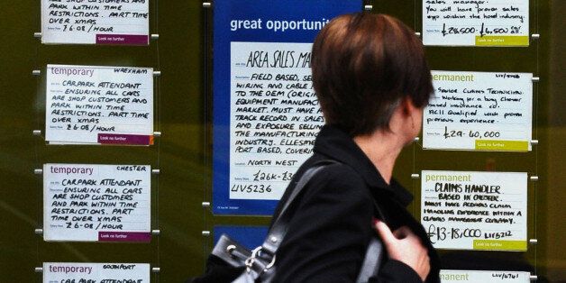 A woman walks past a recruitment agency with adverts in the window in Liverpool on November 16, 2011. Britain's jobless rate hit a 15-year high of 8.3 percent in the three months to September, when youth unemployment surged past one million people for the first time, official data showed on November 16. AFP PHOTO / PAUL ELLIS (Photo credit should read PAUL ELLIS/AFP/Getty Images)
