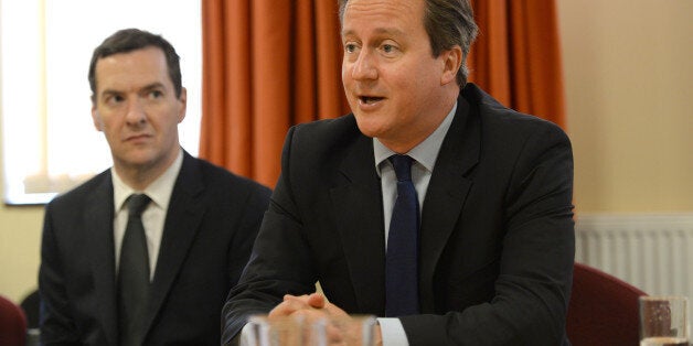 EASTBOURNE, UNITED KINGDOM - AUGUST 1: Prime Minister David Cameron and Chancellor George Osborne meet local business owners and members of East Sussex Fire and Rescue Service at the Fire Station, after the pier extensively damaged by a fire, on August 1, 2014 in Eastbourne, England. The Fire was attended by over 60 firefighters. The pier, a popular seaside attraction, was built in the 1870's and is home to a number of cafes and bars (Photo by Anthony Devlin - WPA Pool/Getty Images)