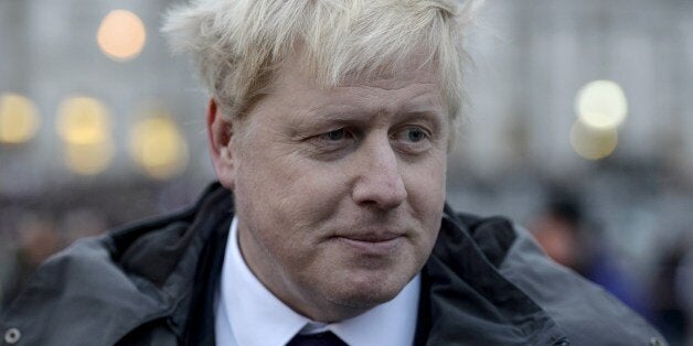 London Mayor Boris Johnson attends a rally in Trafalgar Square in central London on January 11, 2015 to commemorate the victims of the attacks in France that killed 17 people and injured scores more. Around 2,000 people gathered in London to honour the victims of Islamist attacks in Paris, many raising pencils to the sky in memory of those killed at satirical weekly Charlie Hebdo. Some in the crowd at Trafalgar Square carried placards saying 'Je suis Charlie' and waved French flags. AFP PHOTO /