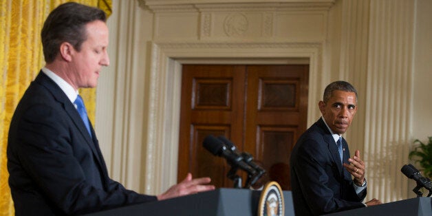 President Barack Obama speaks during a joint news conference with British Prime Minister David Cameron in the East Room of the White House in Washington, Friday, Jan. 16, 2015. In a show of trans-Atlantic unity, President Barack Obama and British Prime Minister David Cameron pledged a joint effort on Friday to fight domestic terrorism following deadly attacks in France. They also strongly urged the U.S. Congress to hold off on implementing new sanctions on Iran in the midst of nuclear talks. (AP Photo/Evan Vucci)