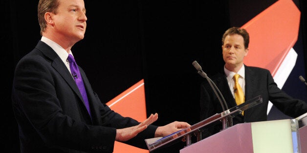 BRISTOL, ENGLAND - APRIL 22: David Cameron (L) of the Conservative Party is watched by Nick Clegg (C) of the Liberal Democrats Party during the live second televised election debate on April 15, 2010 in Bristol, United Kingdom. Britain for the first time is televising three political debates live, reminiscent of the U.S. style of debates. The second of the three planned election debates, focuses on global affairs, airing live on Sky News from 20:00 BST. (Photo by Stefan Rousseau-Pool/Getty Imag