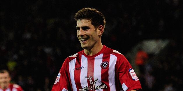 Sheffield United player Ched Evans celebrates after scoring his second goal during the npower League One game between Sheffield United and Chesterfield at Bramall Lane on March 28, 2012 in Sheffield, England. (Photo by Stu Forster/Getty Images)