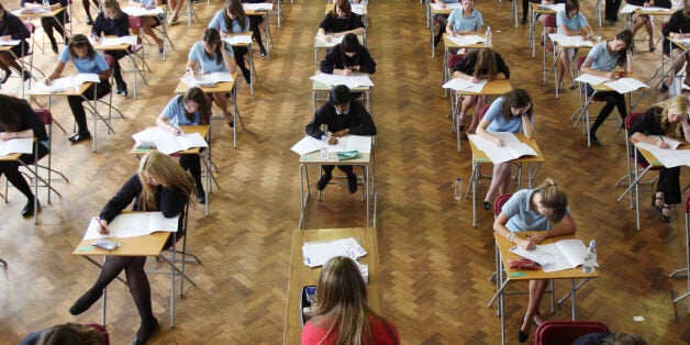 File photo dated 11/06/08 of pupils during a GCSE exam as official figures published by the Department for Education (DfE) show that fewer teenagers scored at least five C grades in their GCSEs, including English and maths, this year amid major changes to the exams and school league tables.