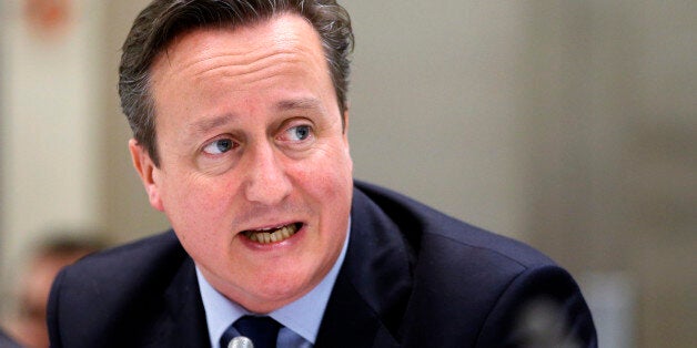 British Prime Minister David Cameron speaks during a meeting ahead of an EU summit in Brussels on Thursday, Dec. 18, 2014. European Union leaders met Thursday to seek solutions to two major challenges, how to jumpstart sluggish economic growth at home, and how to deal long-term with Russia. (AP Photo/Francois Lenoir, Pool)