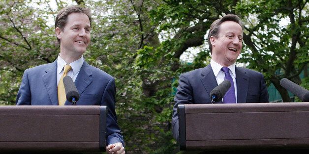 Prime Minister David Cameron (right) and Deputy Prime Minister Nick Clegg hold their first joint press conference in the Downing Street garden in central London.