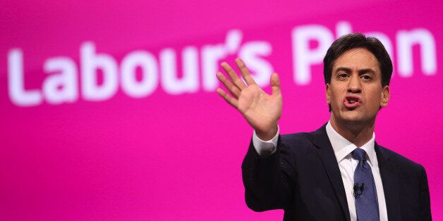 Ed Miliband, leader of the U.K. opposition Labour Party, gestures as he addresses delegates at the party's annual conference in Manchester, U.K., on Tuesday, Sept. 23, 2014. Miliband will today offer voters a 10-year vision of the U.K. if his opposition Labour Party wins power in next year's general election, focusing on bread-and-butter issues such as housing, jobs and pay. Photographer: Chris Ratcliffe/Bloomberg via Getty Images
