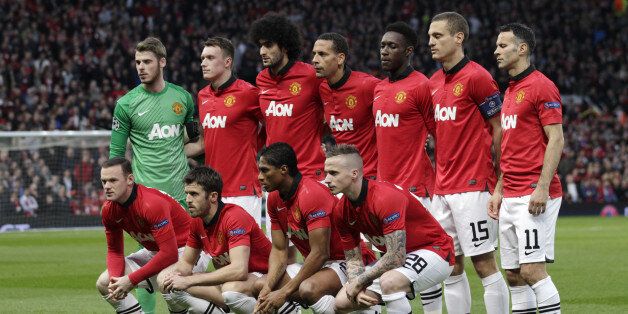 Manchester United players pose for a team photo prior to the Champions League quarterfinal first leg soccer match between Manchester United and Bayern Munich at Old Trafford Stadium, Manchester, England, Tuesday, April 1, 2014.(AP Photo/Jon Super)