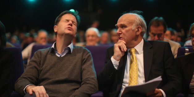 GLASGOW, SCOTLAND - OCTOBER 06: Deputy Prime Minister Nick Clegg (L) and Business secretary Vince Cable chat in the auditorium during the Liberal Democrat Autumn conference at the SECC on October 6, 2014 in Glasgow, Scotland. During his speech Vince Cable said that the conservatives are 'obsessed' with spending cuts, and that many public services were already 'cut to the bone'. (Photo by Christopher Furlong/Getty Images)