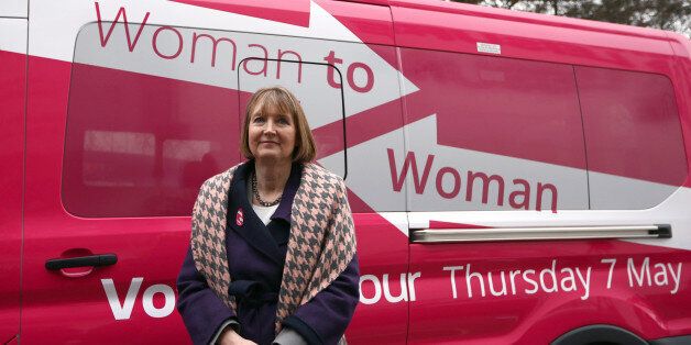 STEVENAGE, ENGLAND - FEBRUARY 11: Deputy Labour leader, Harriet Harman, stands next a pink van launched during a Labour campaign aimed at women voters before a speech on February 11, 2015 in Stevenage, England. Harman has come under fire from a number of commentators who have claimed the pink colour-work is sexist and patronising. (Photo by Carl Court/Getty Images)