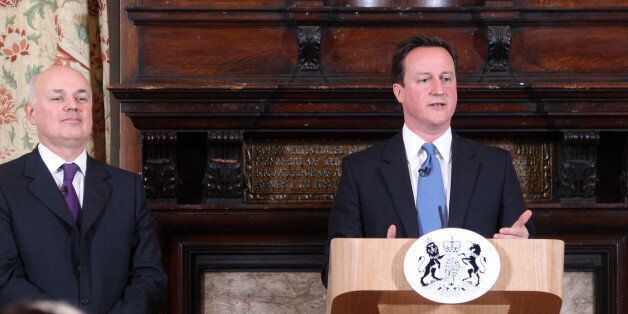 LONDON, UNITED KINGDOM - FEBRUARY 17: British Prime Minister David Cameron makes a speech on welfare alongside Iain Duncan Smith at on February 17, 2011 at Toynbee Hall in London. The Welfare Reform Bill is set to replace the current benefits system with a single Universal Credit,and to help people in long-term unemployment into jobs. (Photo by Lewis Whyld - WPA Pool/Getty Images)