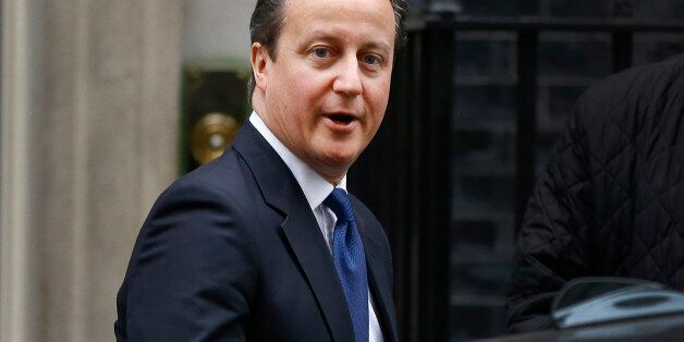 Britain's Prime Minister David Cameron leaves Downing Street to attend the weekly session of Prime Ministers Questions in parliament in London, Wednesday, Jan. 21, 2015. (AP Photo/Kirsty Wigglesworth)