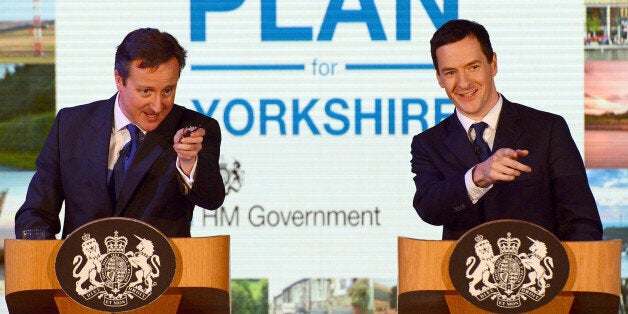 LEEDS, ENGLAND - FEBRUARY 05: Britain's Chancellor Of The Exchequer George Osborne (R) and Prime Minister David Cameron speak to business leaders at the AQL centre on February 5, 2015 in Leeds, England. The politicians are on a tour of Yorkshire to promote investment in the region. (Photo by Nigel Roddis/Getty Images)