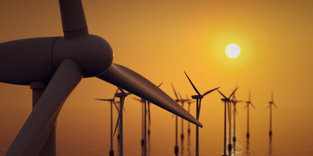 Alternative energy- close up of floating wind farm turbine at sunset.