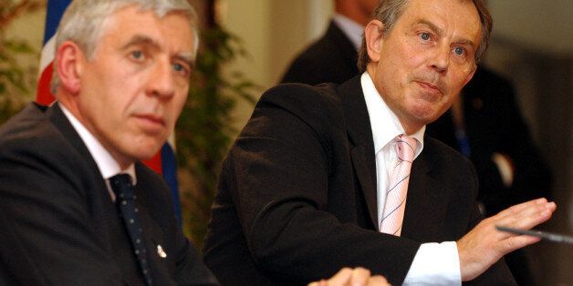 British Prime Minister Tony Blair, right, gestures during a media conference at the end of an EU summit in Brussels Friday June 17, 2005. The failure of the 25 EU leaders to agree on a budget for the European Union in the years ahead has plunged the bloc into a deep crisis. Seated left is British Foreign Secretary Jack Straw. (AP Photo/Geert Vanden Wijngaert)