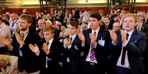 A front row of young supporters applaud as Nigel Farage, the Leader of UKIP (UK Independence Party), delivers his speech at the UKIP party conference, held at Central Hall in Westminster, London.