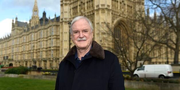 Actor and comedian John Cleese poses for a photograph on College Green outside the Houses of Parliament after he joined the group 'Hacked Off'.