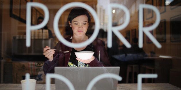 Holly Mac eats a bowl of porridge at the 'Porridge Cafe' in Shoreditch on March 2, 2015 in London, England.
