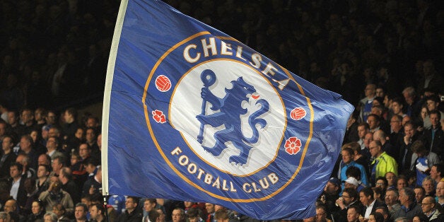 Chelsea fans with a giant flag in the stands