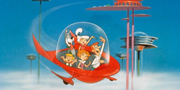 The Jetson family wave as they fly past buildings in space in their spaceship in a still from the animated television series, 'The Jetsons,' circa 1962. (Photo by Warner Bros./Courtesy of Getty Images)