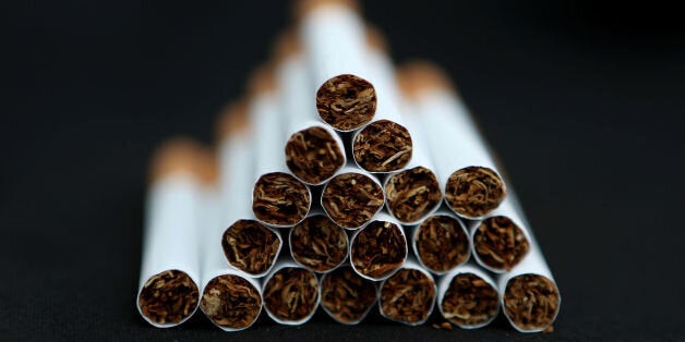 File photo dated 18/03/14 of cigarettes as the tobacco industry is financially linked to the majority of studies showing negative impacts of standardised packaging, a report claims.