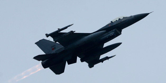 Portugalâs F-16 Falcons jet fighter flies over Siauliai airbase during the NATO's Baltic Air Policing Mission at the Siauliai airbase some 230 kms (144 miles) east of the capital Vilnius, Lithuania, Wednesday, Nov. 19, 2014. The Baltic Air Policing Mission has already been conducted for a decade to stand as a security assurance and a fine example of commitments to collective defence. 15 NATO allies have already conducted 36 rotations of the NATO Air Policing Mission to patrol the airspace of the Baltic States. Currently the Baltic airspace is protected with four F-18 Hornet fighter-jets by 130 air personnel of the Canadian Royal Air Force for the first time in the history of the mission. In support of NATO allies and as a demonstration of solidarity, Canada has deployed its capabilities to strengthen the Portuguese air contingent deployed in Lithuania for the second time. (AP Photo/Mindaugas Kulbis)