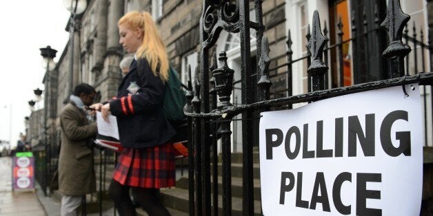 A young voter leaves a polling station after casting her vote in Edinburgh, Scotland, on September 18, 2014, during a referendum on Scotland's independence. Scotland began voting Thursday on whether to become independent, in a referendum that could break up the centuries-old United Kingdom and create Europe's newest country since the collapse of Yugoslavia. AFP PHOTO / LEON NEAL (Photo credit should read LEON NEAL/AFP/Getty Images)