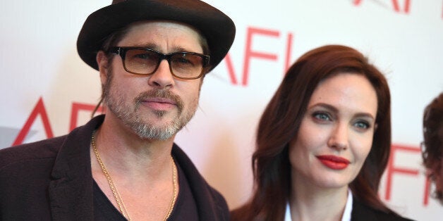 Brad Pitt, left, and Angelina Jolie arrive at the AFI Awards at The Four Seasons Hotel on Friday, Jan. 9, 2015 in Los Angeles. (Photo by Jordan Strauss/Invision/AP)