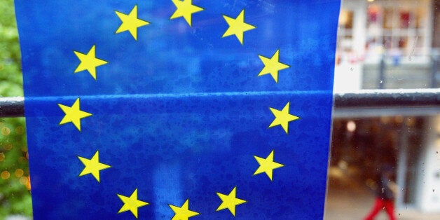 LONDON - APRIL 30: A European Union flag is seen in London's first permanent dual currency zone April 30, 2004 next to the landmark Carnaby Street, London. A day ahead of the expansion of the European Union, shops in the mall will accept either Sterling or Euros with prices marked in both currencies. (Photo by Graeme Robertson/Getty Images)